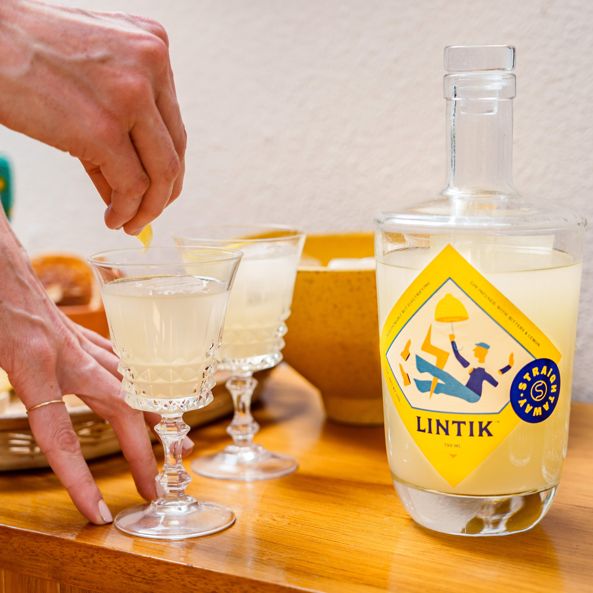 Bottle of Lintik next to two poured cocktails